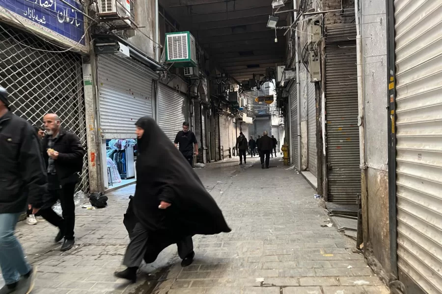 People walk as shops are closed during protests in Tehran’s centuries-old main bazaar, Iran, Tuesday, Jan. 6, 2026. (AP Photo/Vahid Salemi)