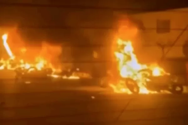 This frame grab from a video released by Iran state TV shows vehicles burning amid night of mass protests in Tehran, Iran, Thursday, Jan. 8, 2026. (Iran state TV via AP)