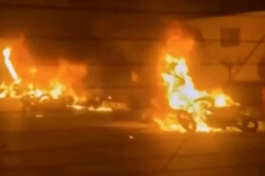 This frame grab from a video released by Iran state TV shows vehicles burning amid night of mass protests in Tehran, Iran, Thursday, Jan. 8, 2026. (Iran state TV via AP)