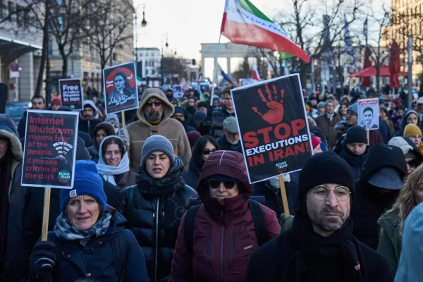 Protesters participate in a demonstration in front of the Brandenburg Gate in Berlin, Germany, in support of the nationwide mass protests in Iran against the government, Sunday, Jan. 11, 2026. (AP Photo/Ebrahim Noroozi)