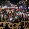 People take part in a rally in support of anti-government protests in Iran, Berlin Germany, Wednesday, June 14, 2026. (AP Photo/Ebrahim Noroozi)