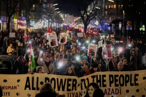 People take part in a rally in support of anti-government protests in Iran, Berlin Germany, Wednesday, June 14, 2026. (AP Photo/Ebrahim Noroozi)