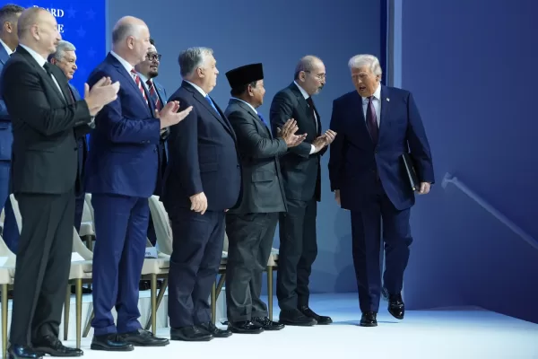 President Donald Trump arrives for a Board of Peace charter announcement during the Annual Meeting of the World Economic Forum in Davos, Switzerland, Thursday, Jan. 22, 2026. (AP Photo/Evan Vucci)