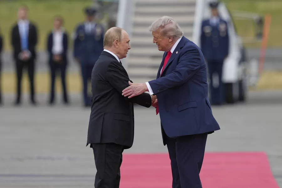 President Donald Trump greets Russia’s President Vladimir Putin Friday, Aug. 15, 2025, at Joint Base Elmendorf-Richardson, Alaska. (AP Photo/Julia Demaree Nikhinson)