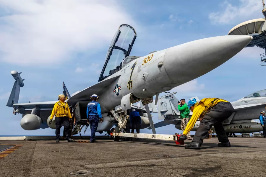 This photo provided by the U.S. Navy shows sailors preparing a Boeing EA-18G Growler on the flight deck of the Nimitz-class aircraft carrier USS Abraham Lincoln in the Indian Ocean on Jan. 21, 2026. (Mass Communication Specialist Seaman Daniel Kimmelman/U.S. Navy via AP) This photo provided by the U.S. Navy shows sailors preparing a Boeing EA-18G Growler on the flight deck of the Nimitz-class aircraft carrier USS Abraham Lincoln in the Indian Ocean on Jan. 21, 2026. (Mass Communication Specialist Seaman Daniel Kimmelman/U.S. Navy via AP)