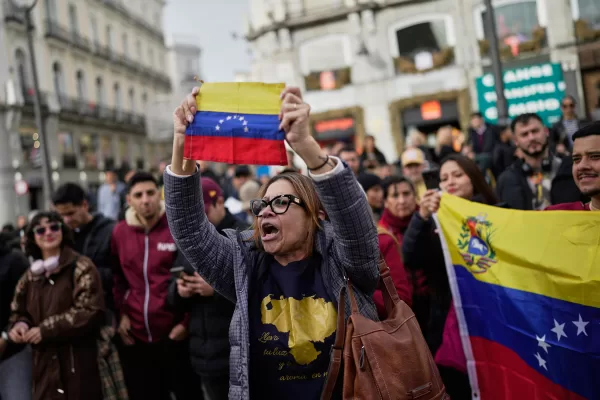 Venezuelans celebrate in Madrid after U.S. President Donald Trump announced that Venezuelan President Nicolás Maduro had been captured and flown out of the country on Saturday, Jan. 3, 2026. (AP Photo/Bernat Armangue)