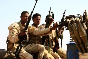 FILE – Sudanese soldiers from the Rapid Support Forces unit patrol during a rally for Dagalo, in Garawee town, north of Sudan, Saturday, June 15, 2019. (AP Photo) FILE – Sudanese soldiers from the Rapid Support Forces unit patrol during a rally for Dagalo, in Garawee town, north of Sudan, Saturday, June 15, 2019. (AP Photo)