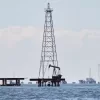 Oil rigs stands on Lake Maracaibo in Cabimas, Venezuela, Wednesday, Jan. 7, 2026. (AP Photo/Edgar Frias)