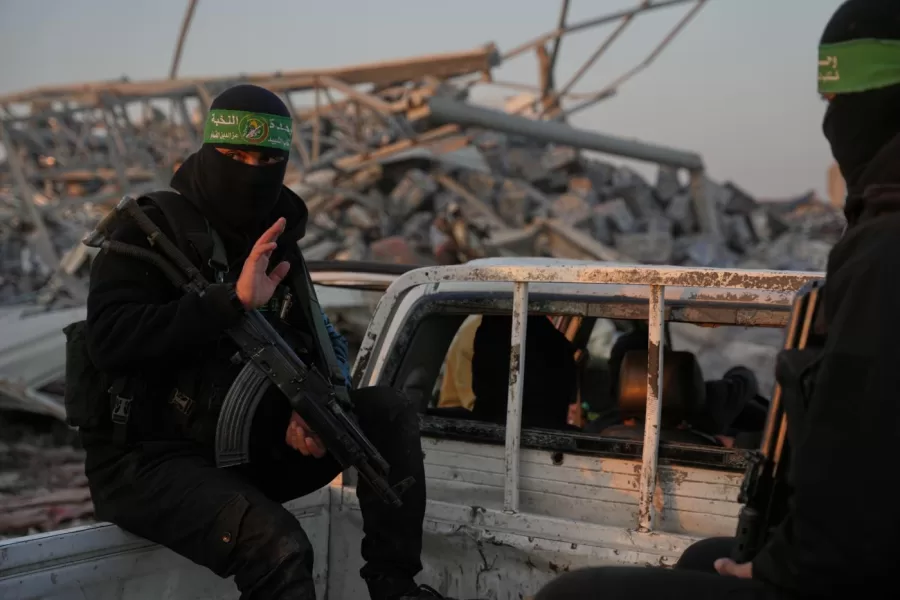 Hamas militants search for the remains of Israeli hostage in Zeitoun neighborhood of Gaza City, Wednesday, Jan. 7, 2026. (AP Photo/Abdel Kareem Hana)