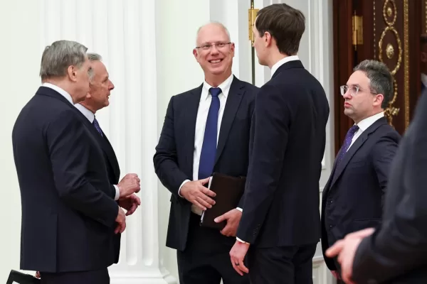 Kremlin foreign policy adviser Yuri Ushakov, left, U.S. President Donald Trump’s envoy Steve Witkoff, second left, Putin’s envoy Kirill Dmitriev, center, and Trump’s envoys Jared Kushner, second right, and Josh Gruenbaum, the head of the Federal Acquisition Service at the General Services Administration talk to each other prior to their meeting with Russian President Vladimir Putin at the Senate Palace of the Kremlin, in Moscow, Thursday, Jan. 22, 2026. (Alexander Kazakov/Sputnik, Kremlin Pool Photo via AP)