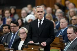 Prime Minister Mark Carney rises in the House of Commons Wednesday, Feb.11, 2026. (Adrian Wyld/The Canadian Press via AP) Prime Minister Mark Carney rises in the House of Commons Wednesday, Feb.11, 2026. (Adrian Wyld/The Canadian Press via AP)