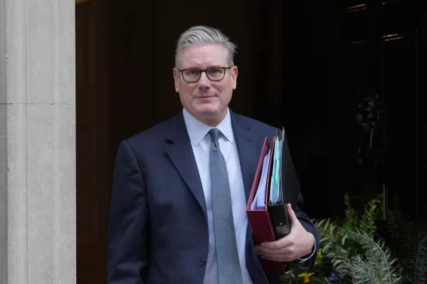 Britain’s Prime Minister Keir Starmer leaves 10 Downing Street to attend the weekly Prime Ministers’ Questions session in parliament in London, Wednesday, Feb. 25, 2026. (AP Photo/Kin Cheung)