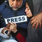 FILE – Al Jazeera journalist Wael Dahdouh holds the hand of his son, Hamza, who also worked for Al Jazeera and was killed in an Israeli airstrike, in Rafah, Gaza Strip, Jan. 7, 2024. (AP Photo/Hatem Ali, File)


Associated Press/LaPresse