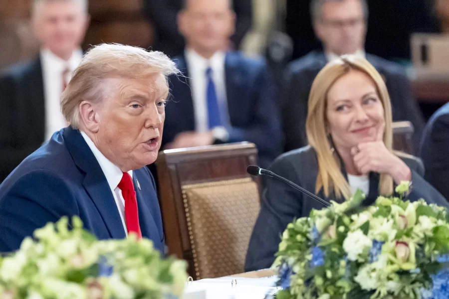 President Donald Trump, left, speaks as Italian Prime Minister Giorgia Meloni listens during a meeting in the East Room of the White House, Monday, Aug. 18, 2025, in Washington. (AP Photo/Alex Brandon)
