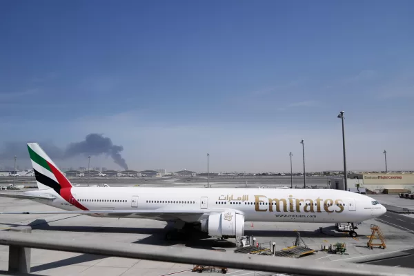 An Emirates plane is parked at the Dubai International Airport after its closure in Dubai, United Arab Emirates, Sunday, March 1, 2026. (AP Photo/Altaf Qadri)