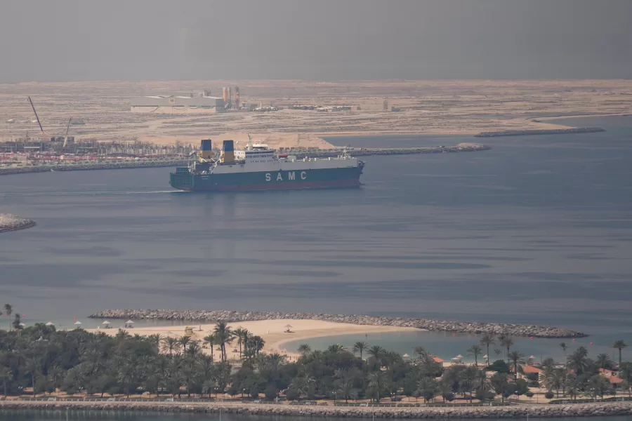 A cargo ship is seen leaving the Dubai port, United Arab Emirates, Sunday, March 15, 2026. (AP Photo/Altaf Qadri)