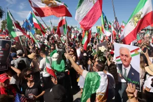 People chant slogans with a portrait of Reza Pahlavi, the exiled son of Iran’s last shah overthrown during the 1979 Islamic Revolution, during a demonstration in support of the U.S. and Israeli strikes on Iran on Sunday, March 1, 2026, in Los Angeles. (AP Photo/Jill Connelly) People chant slogans with a portrait of Reza Pahlavi, the exiled son of Iran’s last shah overthrown during the 1979 Islamic Revolution, during a demonstration in support of the U.S. and Israeli strikes on Iran on Sunday, March 1, 2026, in Los Angeles. (AP Photo/Jill Connelly)