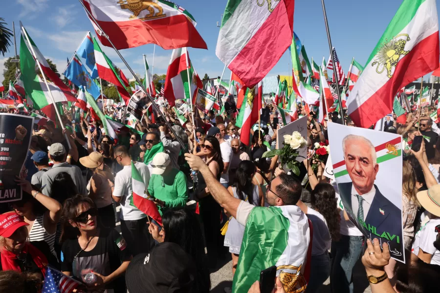People chant slogans with a portrait of Reza Pahlavi, the exiled son of Iran’s last shah overthrown during the 1979 Islamic Revolution, during a demonstration in support of the U.S. and Israeli strikes on Iran on Sunday, March 1, 2026, in Los Angeles. (AP Photo/Jill Connelly)