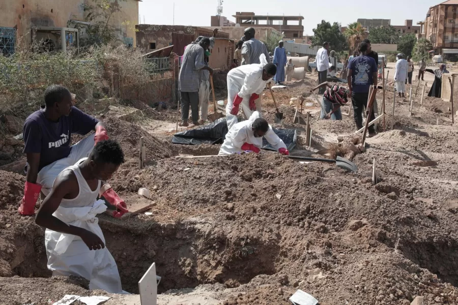 Members of the Sudanese Red Crescent rebury the remains of victims of Sudans two-year conflict, transferring bodies from makeshift graves to a local cemetery in Khartoum, Sudan, Sunday, Jan. 11, 2026. (AP Photo/Marwan Ali)