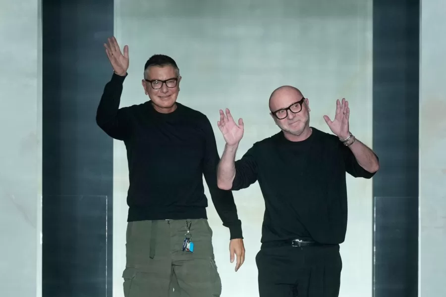 Italian stylists Stefano Dolce, left, and Domenico Gabbana arrive on the catwalk at the end of the presentation of their Fall/Winter 2026-2027 Men’s collection, in Milan, Italy, Saturday, Jan. 17, 2026. (AP Photo/Luca Bruno)