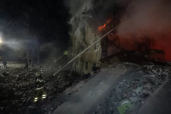 Firefighters put out the fire in an multi-storey apartment building following a Russian missile attack in Kharkiv, Ukraine, Saturday, March 7, 2026. (AP Photo/Andrii Marienko)