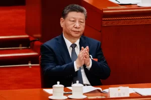 Chinese President Xi Jinping applauds during a plenary session of China’s National People’s Congress, in Beijing, China, Monday, March 9, 2026. (AP Photo/Vincent Thian)
