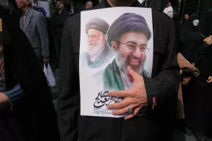 A mourner holds a poster depicting Ayatollah Mojtaba Khamenei, right, the successor to his late father Ayatollah Ali Khamenei, left, as supreme leader, during the funeral procession for senior Iranian military officials and civilians killed during the U.S.-Israel campaign in Tehran, Iran, Wednesday, March 11, 2026. (AP Photo/Vahid Salemi)





Associate Press/ LaPresse
Only Italy and Spain