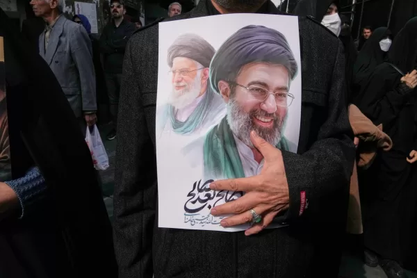 A mourner holds a poster depicting Ayatollah Mojtaba Khamenei, right, the successor to his late father Ayatollah Ali Khamenei, left, as supreme leader, during the funeral procession for senior Iranian military officials and civilians killed during the U.S.-Israel campaign in Tehran, Iran, Wednesday, March 11, 2026. (AP Photo/Vahid Salemi)





Associate Press/ LaPresse
Only Italy and Spain