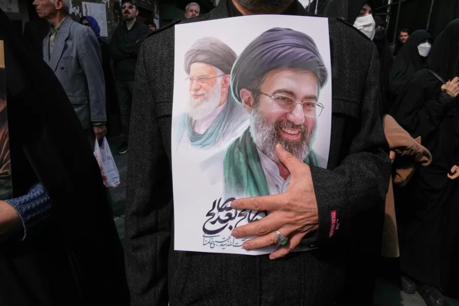 A mourner holds a poster depicting Ayatollah Mojtaba Khamenei, right, the successor to his late father Ayatollah Ali Khamenei, left, as supreme leader, during the funeral procession for senior Iranian military officials and civilians killed during the U.S.-Israel campaign in Tehran, Iran, Wednesday, March 11, 2026. (AP Photo/Vahid Salemi)





Associate Press/ LaPresse
Only Italy and Spain