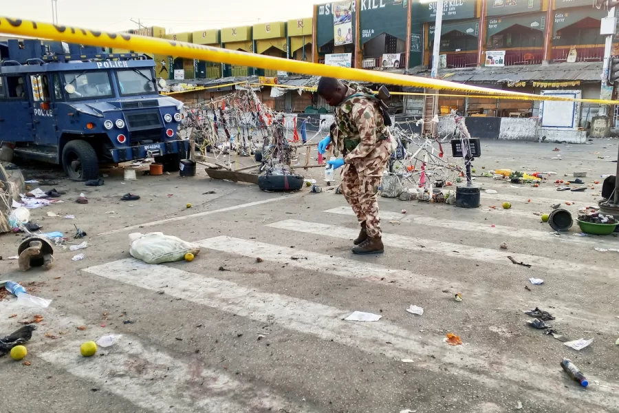 A soldier inspects the aftermath of Monday’s bomb blast at a market in Maiduguri, Nigeria, Tuesday, March 17, 2026. (AP Photo/Jossy Ola )
