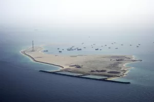 Ships sit anchored off Dubai, United Arab Emirates, Friday, May 19, 2023. The Mideast-based chiefs of the U.S., British and French navies transited the Strait of Hormuz on Friday aboard an American warship, a sign of their unified approach to keep the crucial waterway open after Iran seized two oil tankers. (AP Photo/Jon Gambrell)