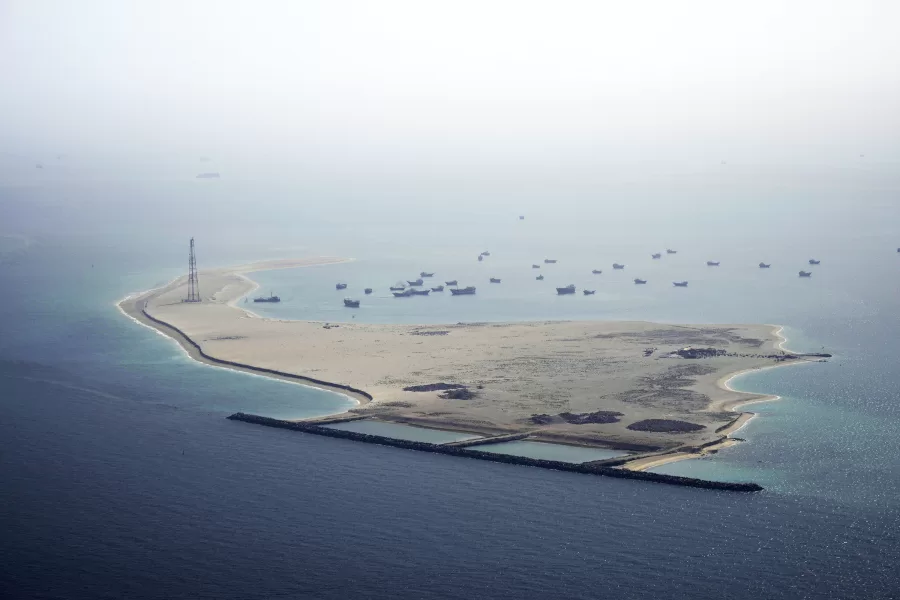 Ships sit anchored off Dubai, United Arab Emirates, Friday, May 19, 2023. The Mideast-based chiefs of the U.S., British and French navies transited the Strait of Hormuz on Friday aboard an American warship, a sign of their unified approach to keep the crucial waterway open after Iran seized two oil tankers. (AP Photo/Jon Gambrell)