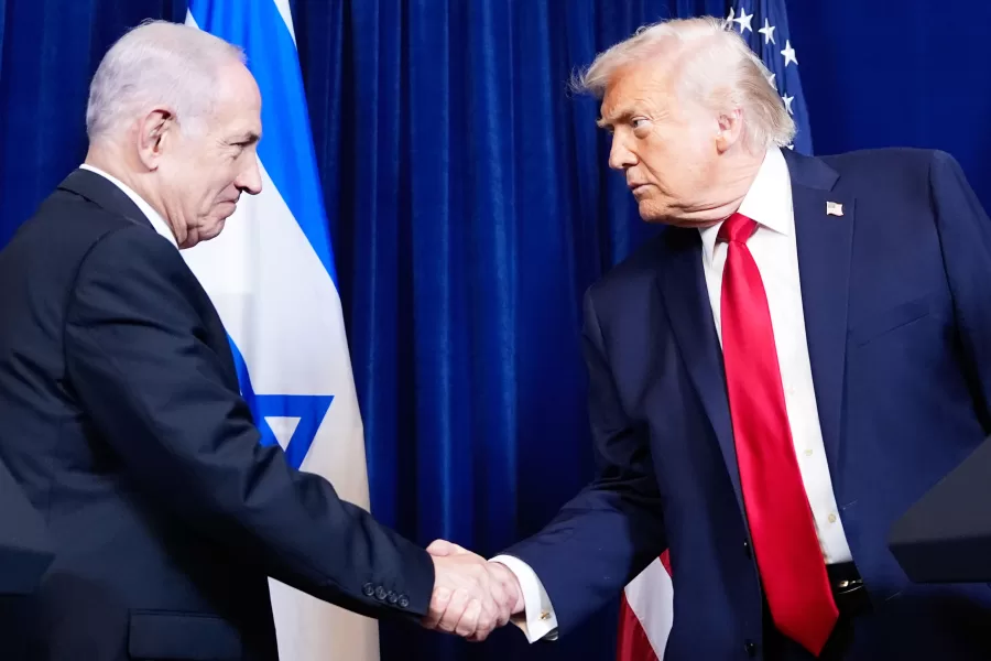 President Donald Trump shakes hands with Israel’s Prime Minister Benjamin Netanyahu during a news conference at Mar-a-Lago, Monday, Dec. 29, 2025, in Palm Beach, Fla. (AP Photo/Alex Brandon)