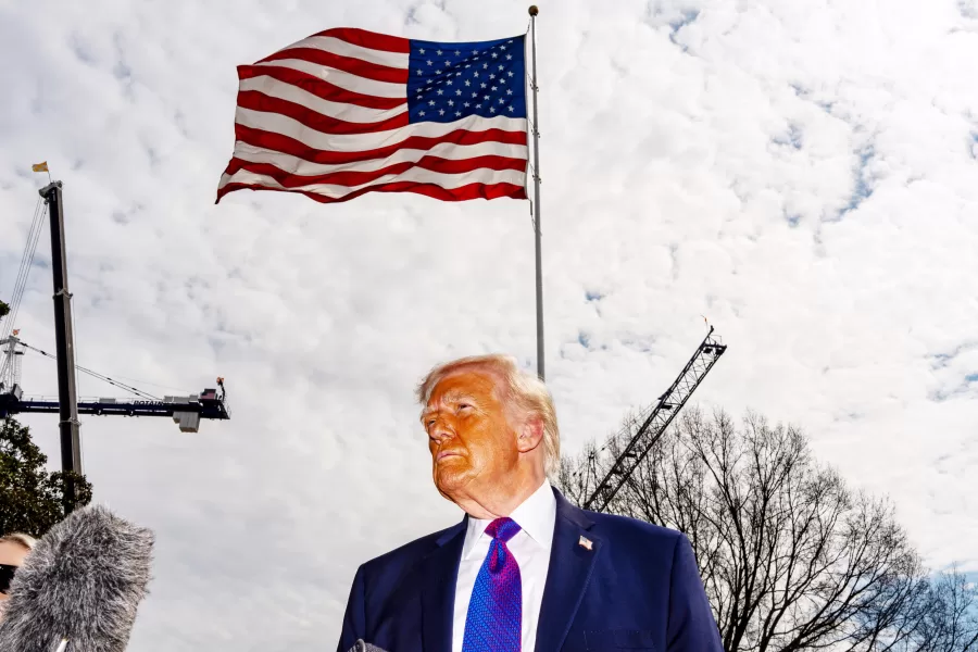 President Donald Trump speaks with reporters before departing on Marine One from the South Lawn of the White House, Wednesday, March 11, 2026, in Washington. (AP Photo/Alex Brandon)