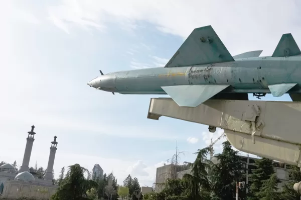 A missile is displayed in a permanent exhibition at a recreational area as minarets of a mosque are seen at rear, in northern Tehran, Iran, Tuesday, March 24, 2026. (AP Photo/Vahid Salemi)