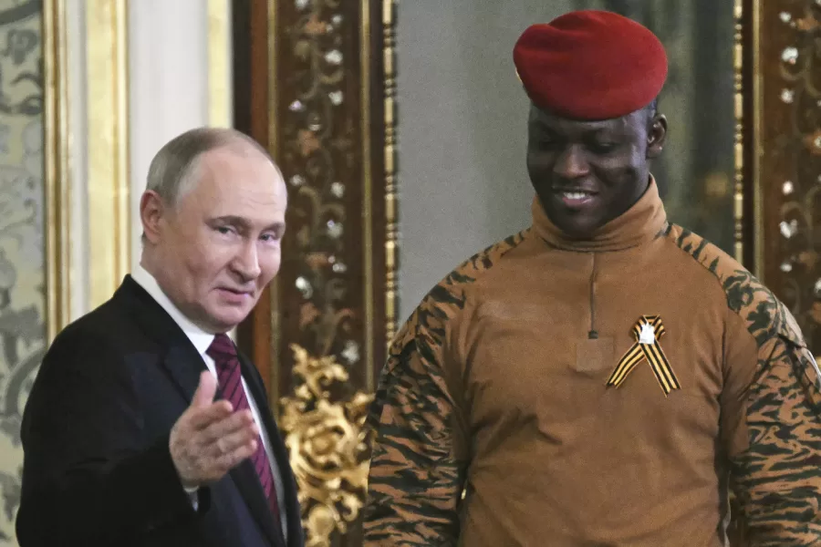 Russian President Vladimir Putin, left, welcomes Burkina Faso President Ibrahim Traore for the talks in the Grand Palace at the Kremlin in Moscow, Russia, on Saturday, May 10, 2025, as part of celebrations of the 80th anniversary of the Soviet Union’s victory over Nazi Germany during the World War II. (Angelos Tzortzinis/Pool Photo via AP)
