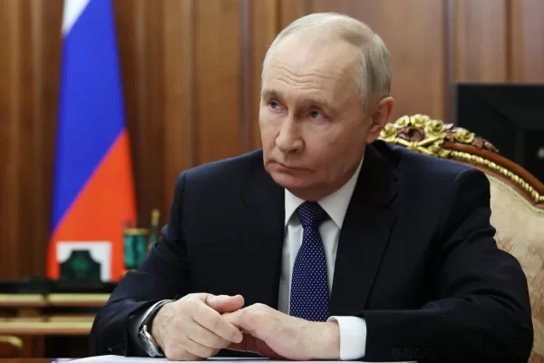 FILE – Russian President Vladimir Putin listens to Roman Artyukhin, the head of the treasury, at the Kremlin in Moscow, on Tuesday, March 3, 2026. (Gavriil Grigorov/Sputnik, Kremlin Pool Photo via AP, File)