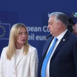 Italy’s Prime Minister Giorgia Meloni, left, speaks with Hungary’s Prime Minister Viktor Orban prior to a group photo of leaders at the EU summit in Brussels, Thursday, March 19, 2026. (AP Photo/Omar Havana)