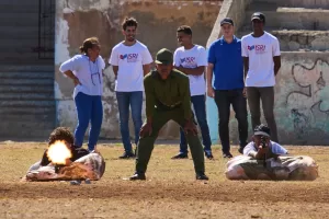 Civilians fire blanks during basic military training given by soldiers who rotate weekly self-defense lessons through different neighborhoods, calling the events “Defense Day,” in Havana, Cuba, Friday, March 27, 2026. (AP Photo/Ramon Espinosa)
