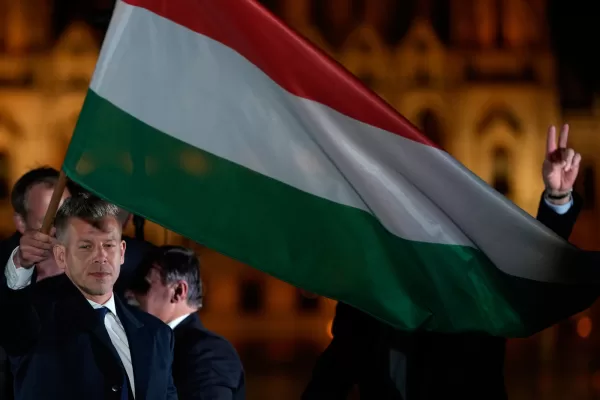 Peter Magyar, the leader of the opposition Tisza party waves a national flag after claiming victory in a parliamentary election in Budapest, Hungary, Sunday, April 12, 2026. (AP Photo/Darko Bandic) Peter Magyar, the leader of the opposition Tisza party waves a national flag after claiming victory in a parliamentary election in Budapest, Hungary, Sunday, April 12, 2026. (AP Photo/Darko Bandic)