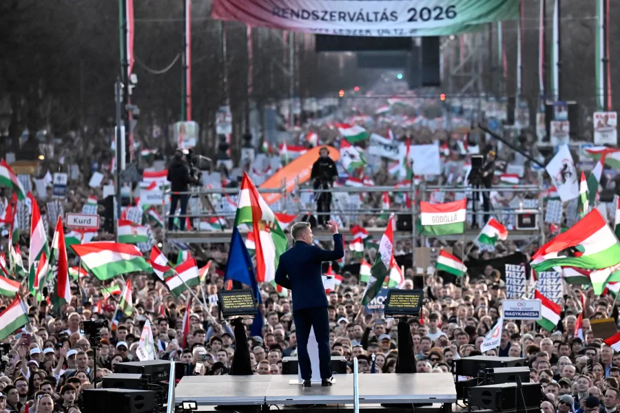 Opposition leader Peter Magyar, center, addresses his supporters during a march in Budapest, Sunday, March 15, 2026. (AP Photo/Denes Erdos)