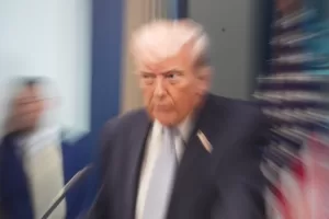 A zoom lens and slow shutter speed technique shows President Donald Trump speaking with reporters in the James Brady Press Briefing Room at the White House, Monday, April 6, 2026, in Washington.(AP Photo/Alex Brandon)
