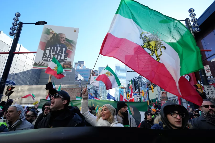 Protesters march in support of regime change in Iran during a rally in Toronto, Sunday, Feb. 1, 2026. (AP Photo/Kamran Jebreili)