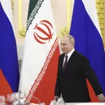 Russian President Vladimir Putin arrives to attend talks with Iranian President Ebrahim Raisi at the Kremlin in Moscow, Russia, Thursday, Dec. 7, 2023. (Sergei Bobylev, Sputnik, Kremlin Pool Photo via AP)