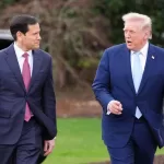 President Donald Trump walks with Secretary of State Marco Rubio before departing on Marine One from the South Lawn of the White House, Friday, March 20, 2026, in Washington. (AP Photo/Alex Brandon)