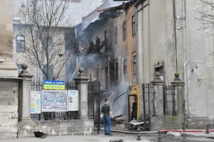 Firefighters put out a fire in the city center following Russia’s drone attack in Lviv, Ukraine, Tuesday, March 24, 2026. (AP Photo/Mykola Tys)