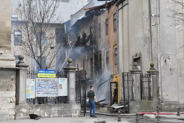 Firefighters put out a fire in the city center following Russia’s drone attack in Lviv, Ukraine, Tuesday, March 24, 2026. (AP Photo/Mykola Tys)