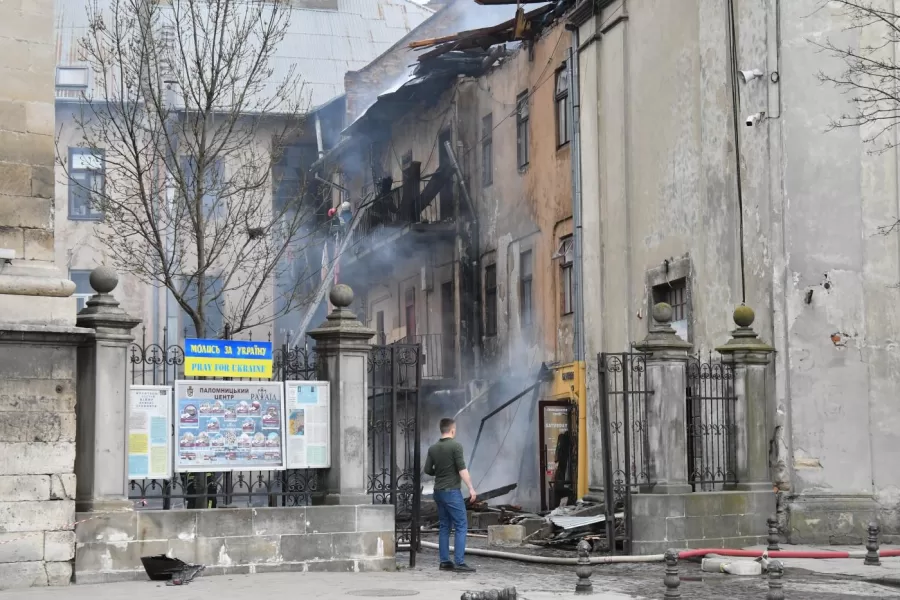 Firefighters put out a fire in the city center following Russia’s drone attack in Lviv, Ukraine, Tuesday, March 24, 2026. (AP Photo/Mykola Tys)