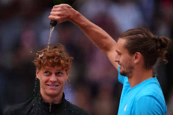 Alexander Zverev, of Germany, right, pours sparkling wine over the head of Jannik Sinner, of Italy, at the end of the men’s singles tennis final match against at the Madrid Open tennis tournament in Madrid, Spain, Sunday, May 3, 2026. (AP Photo/Manu Fernandez)