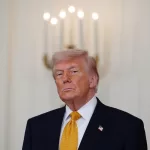 President Donald Trump, with first lady Melania Trump, not shown, attends an event for military mothers in the East Room of the White House, Wednesday, May 6, 2026, in Washington. (AP Photo/Julia Demaree Nikhinson)